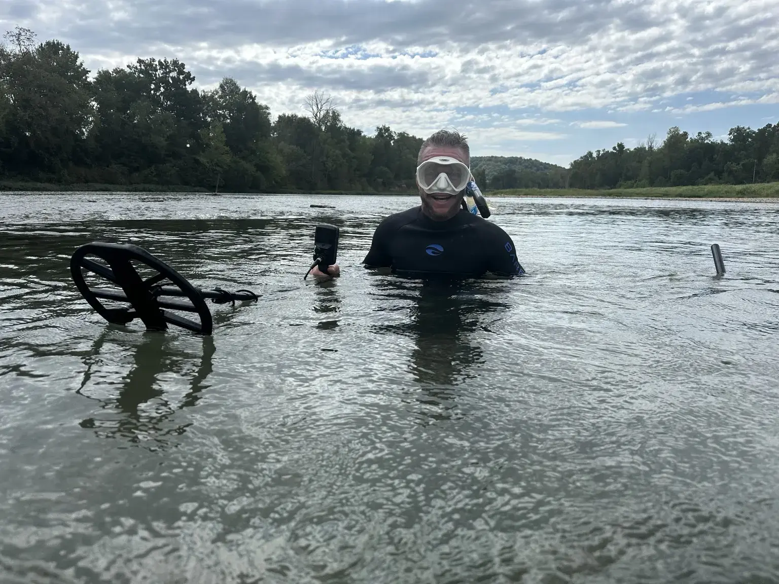 Derik Keith conducting an underwater metal-detecting recovery search with dive equipment